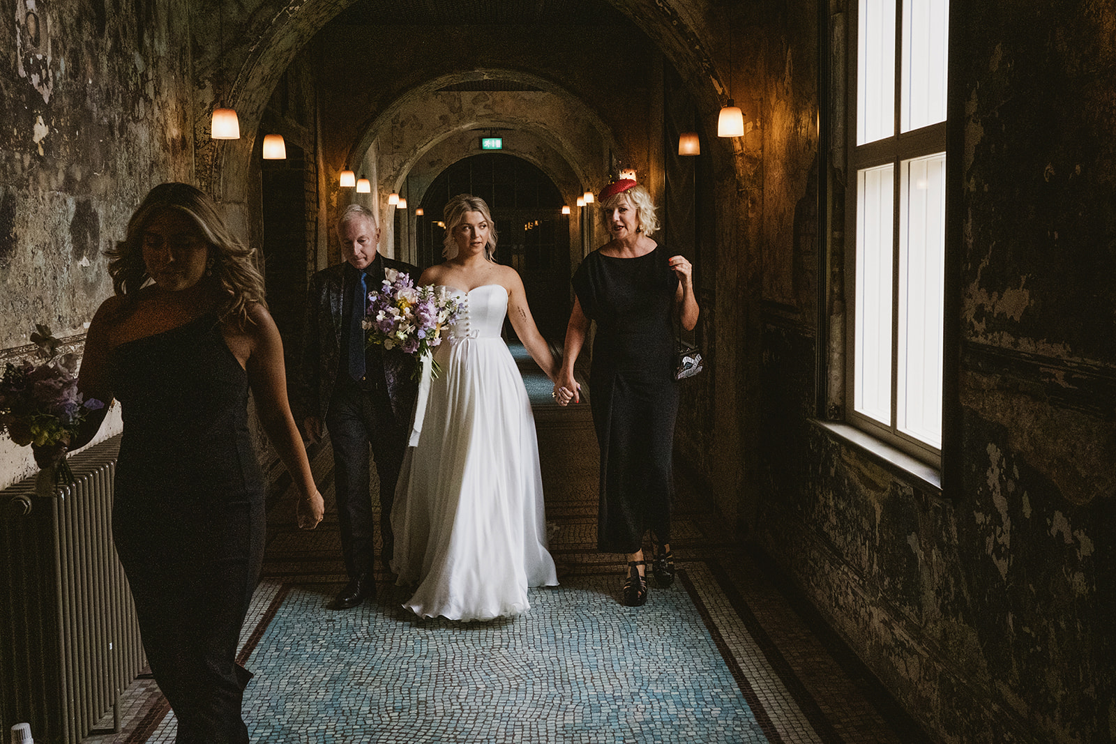 photos from a Battersea Arts Centre wedding with meadow style florals and natural street photography style with York Place Studios