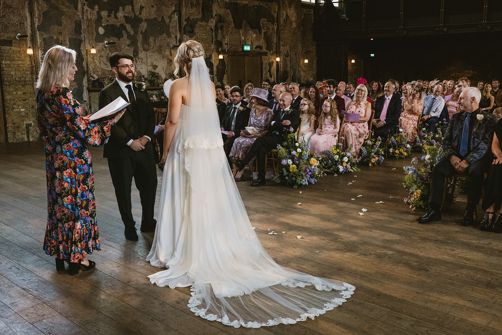 photos from a Battersea London wedding with meadow style florals and natural street photography style with York Place Studios