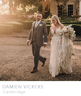 image of a groom and bride outside a beautiful venue at golden hour by Damien Vickers Photography Cambridge