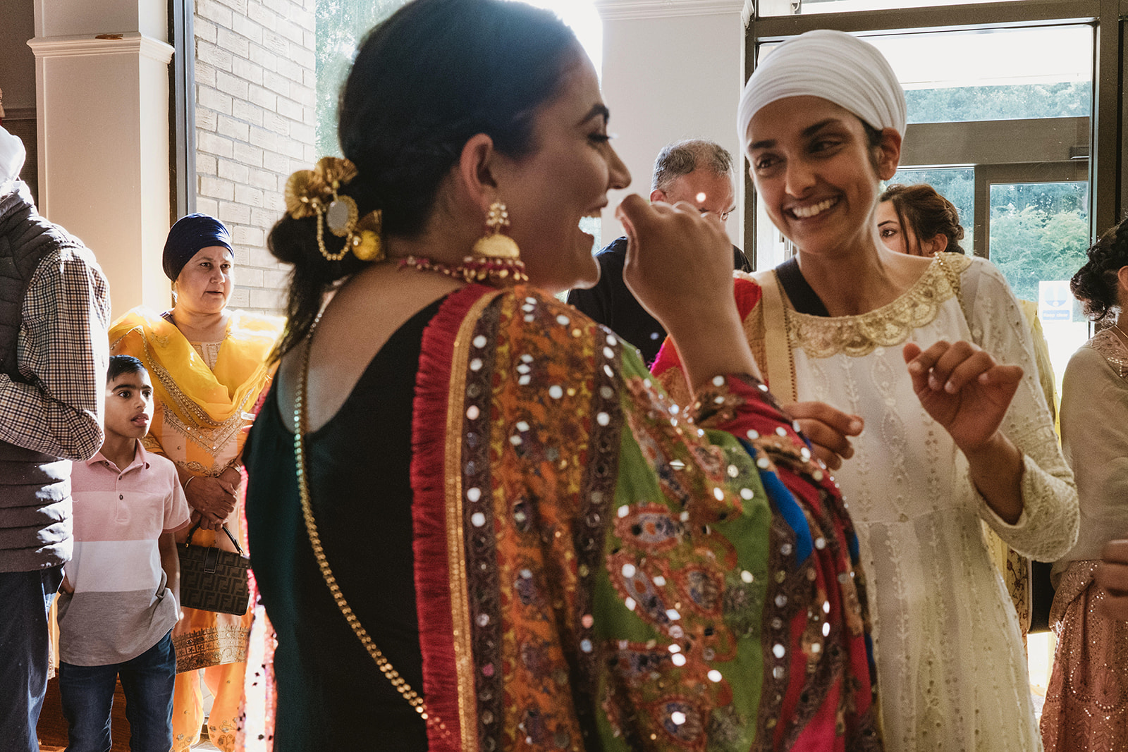 Authentic moments from a Sikh wedding photographed in a modern documentary style with photographs by York Place Studios