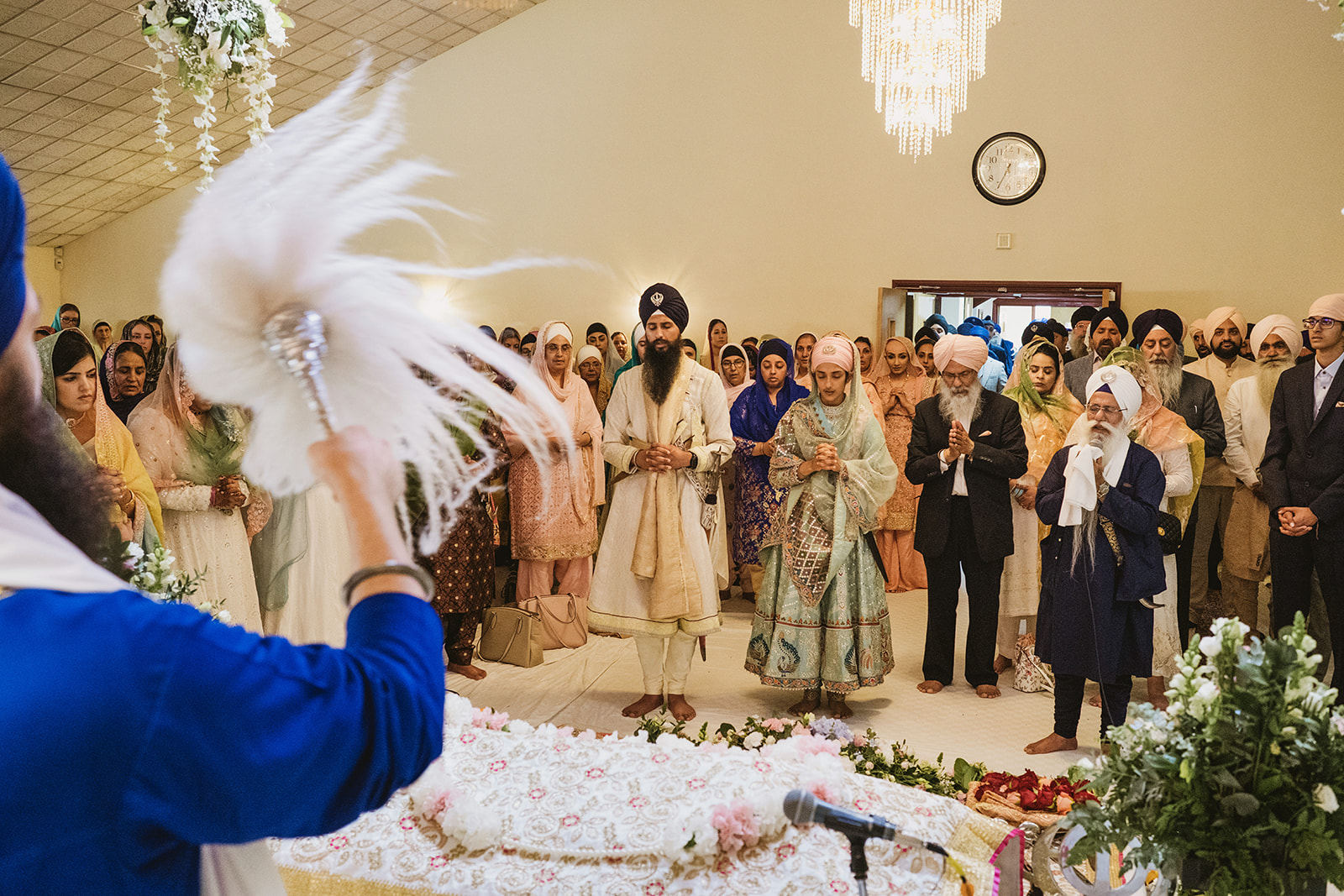 Peaceful, joyful and chaotic moments from a Sikh wedding photographed in a modern documentary style with photographs by York Place Studios