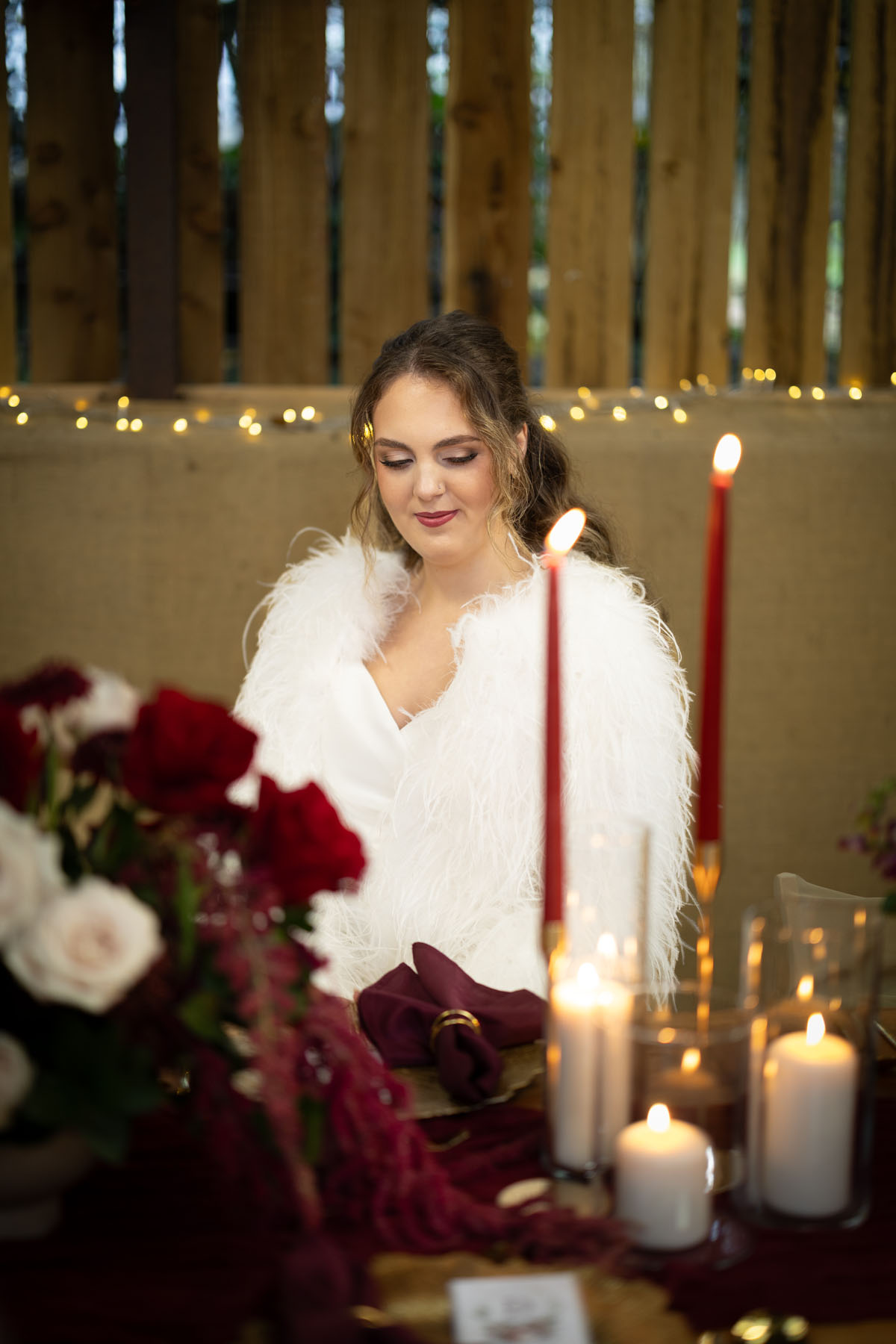 warm red winter wedding ideas with candlelight from a setup at Battleford with photographer Howard South West