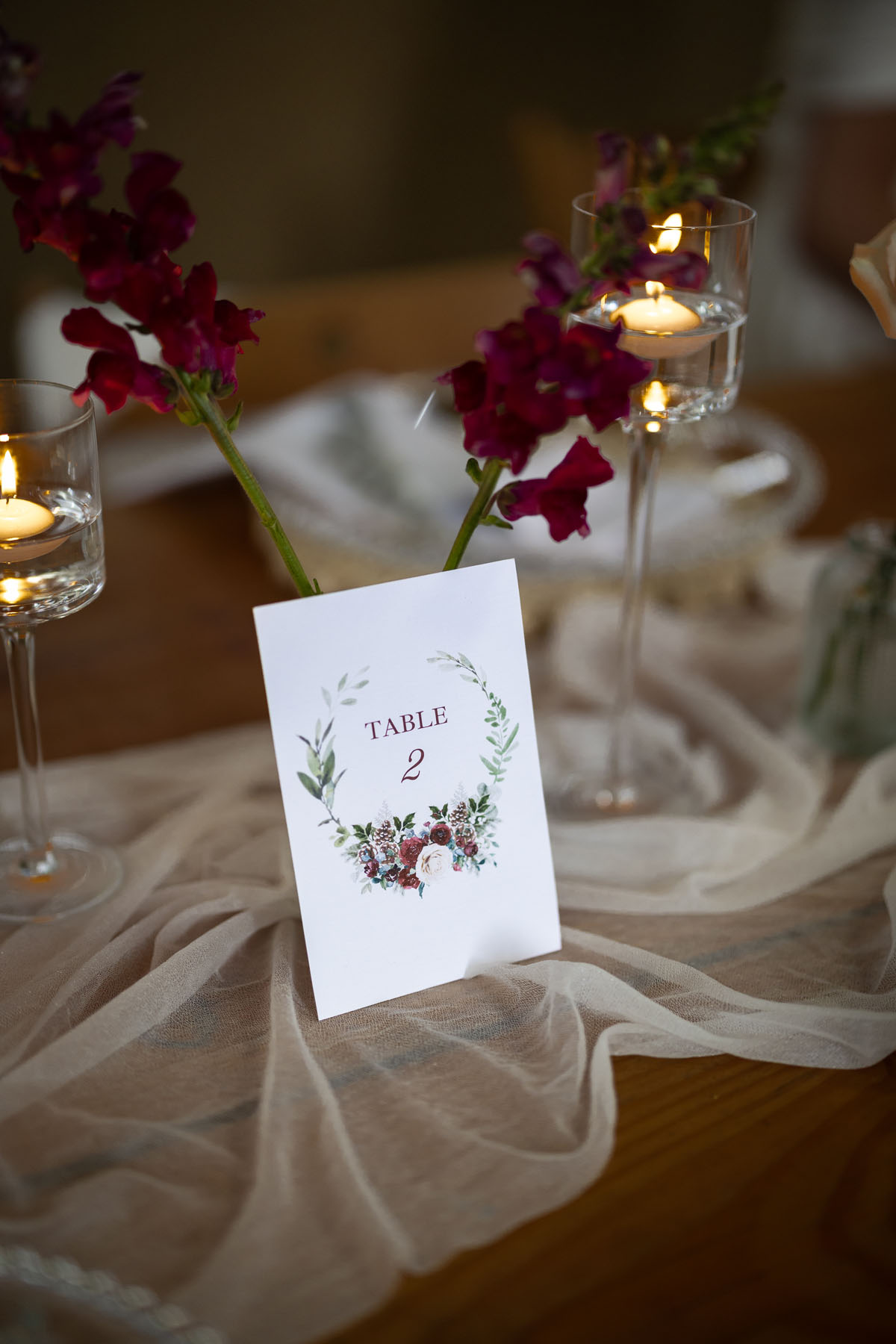 warm red winter wedding ideas with candlelight from a setup at Battleford with photographer Howard South West