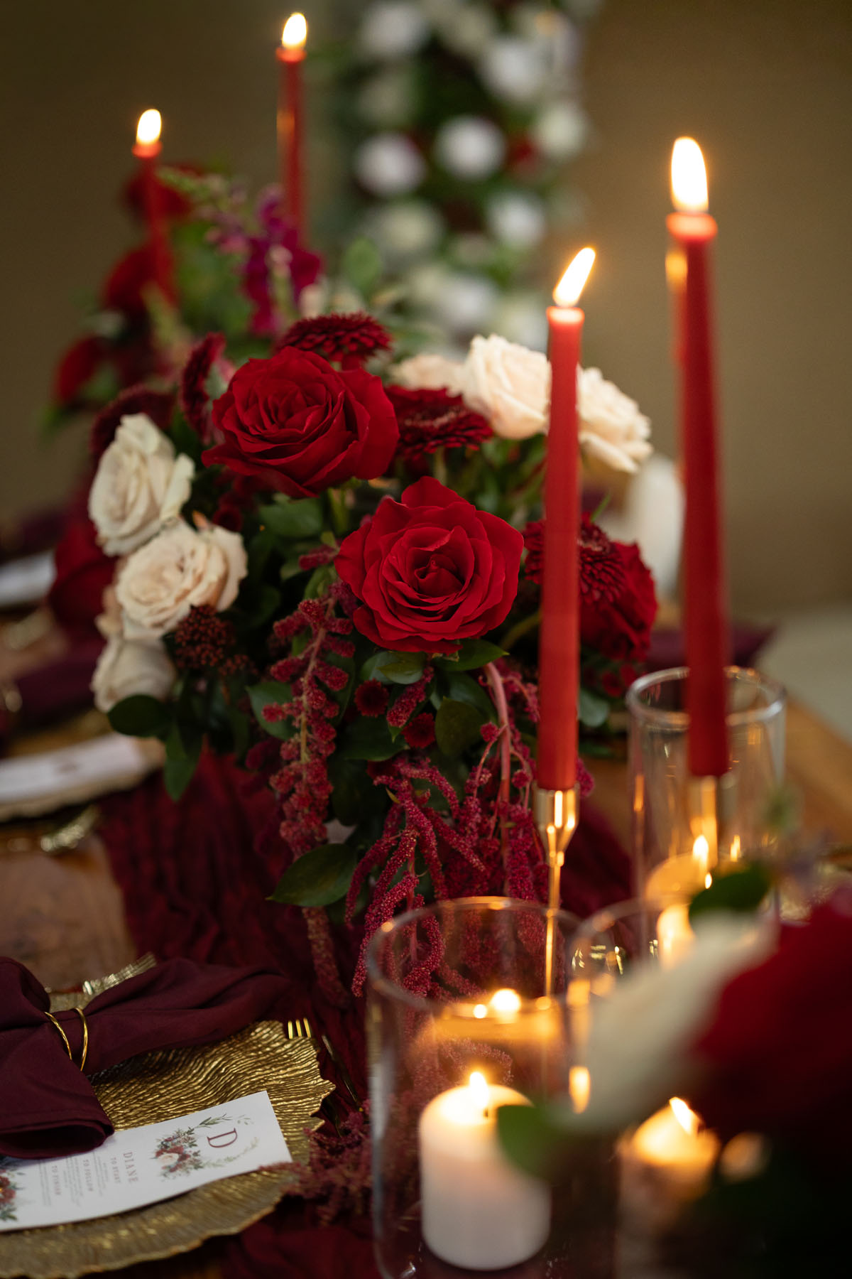 warm red winter wedding ideas with candlelight from a setup at Battleford with photographer Howard South West