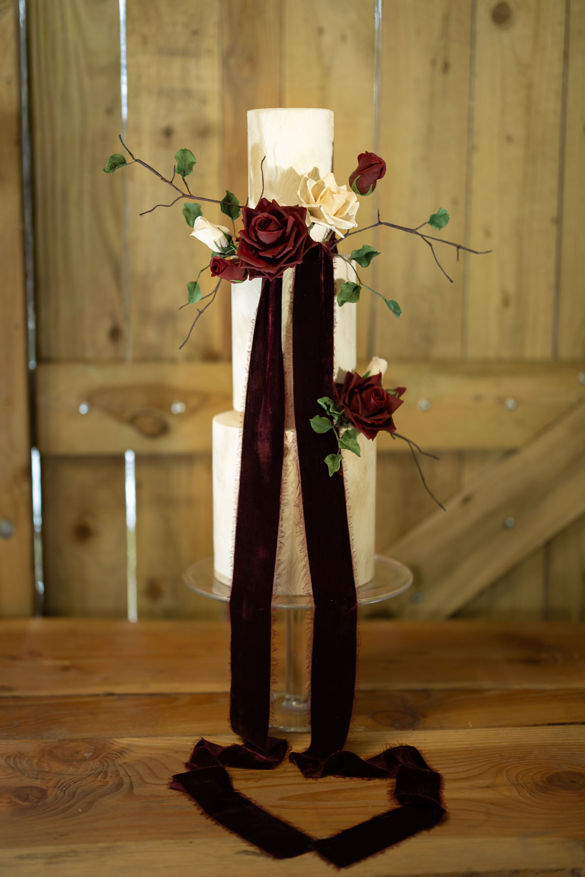 warm red winter wedding ideas with candlelight from a setup at Battleford with photographer Howard South West