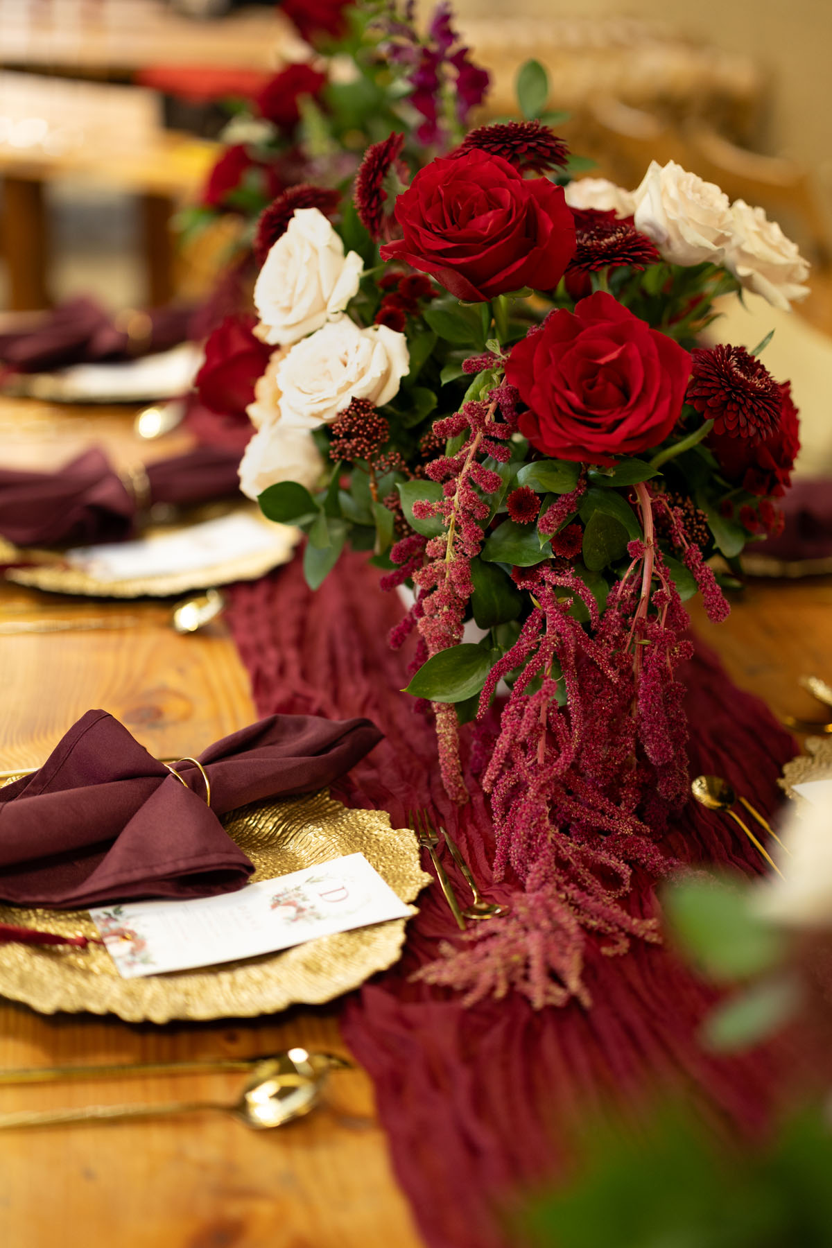 warm red winter wedding ideas with candlelight from a setup at Battleford with photographer Howard South West