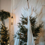 Christmas tree placeholder image with white draped fabric bow