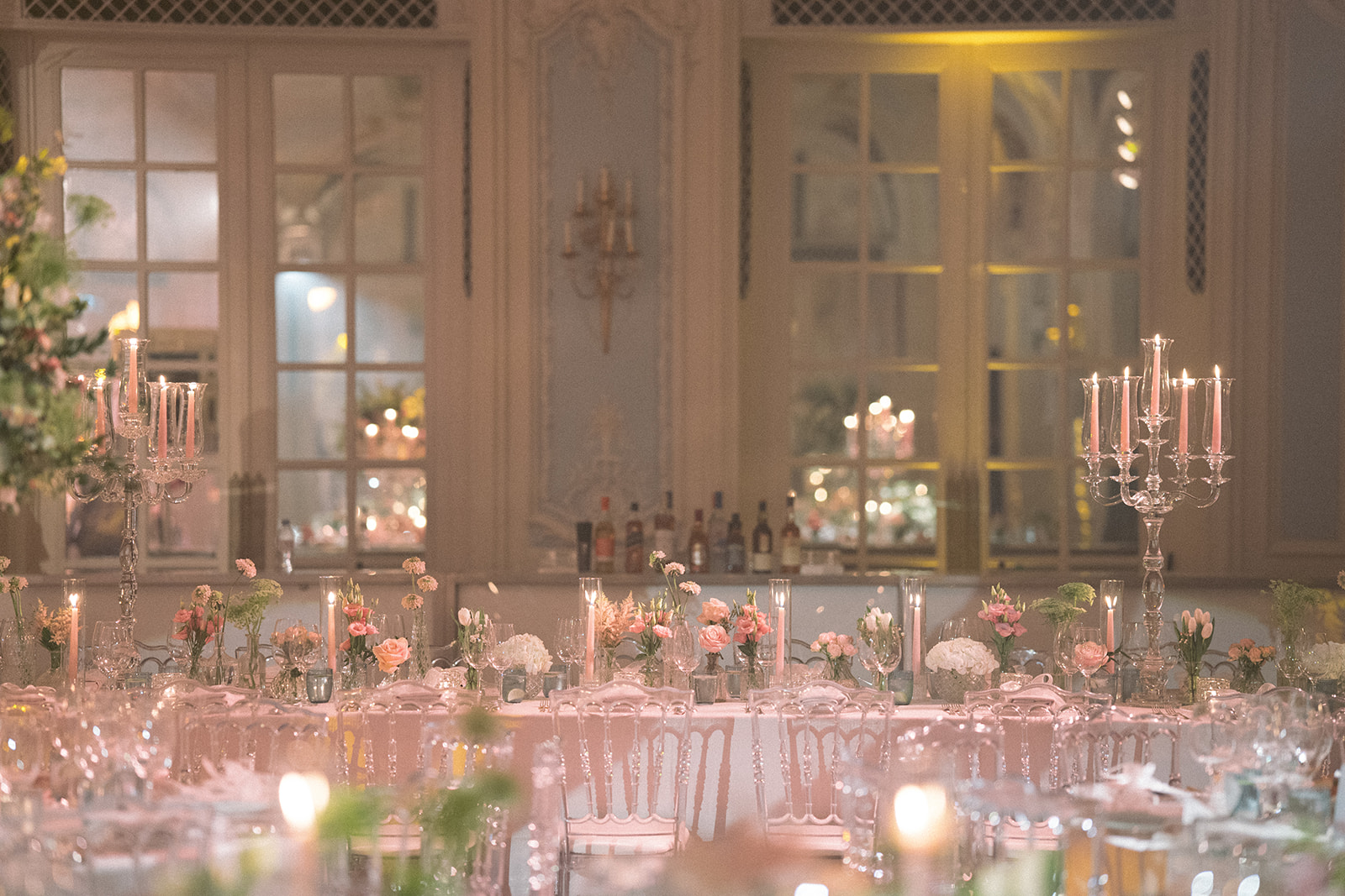 photograph of a luxury wedding at The Savoy in London with romantic floral styling and candlelight by Rachel Takes Pictures with Elegante by Michelle J