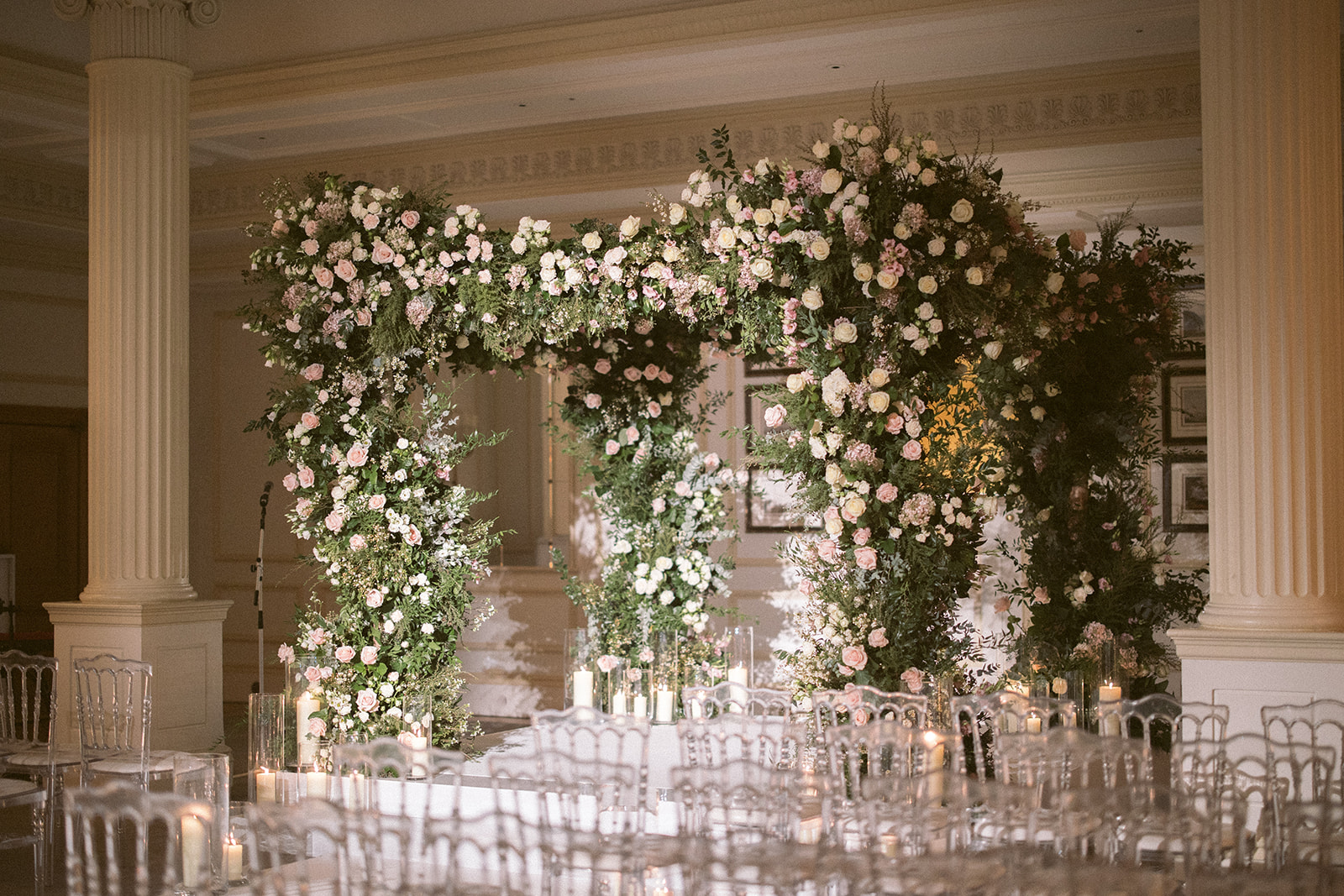 photograph of a luxury wedding at The Savoy in London with romantic floral styling and candlelight by Rachel Takes Pictures with Elegante by Michelle J