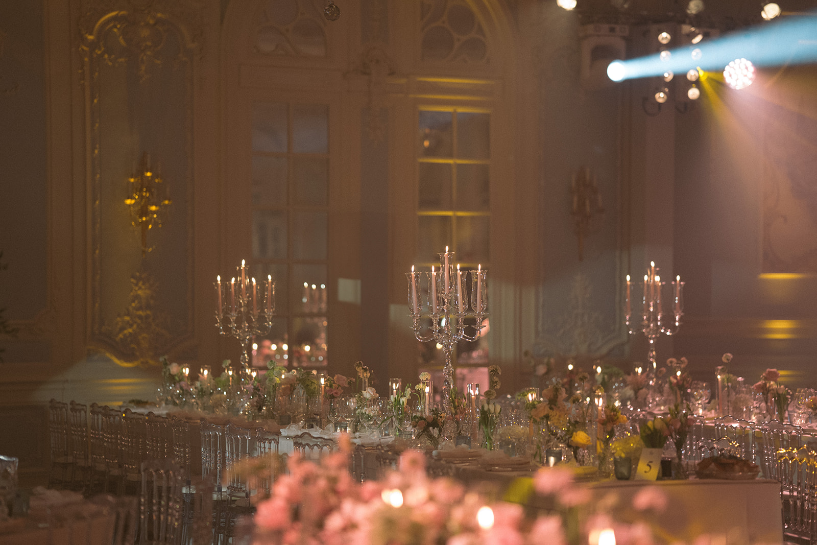 photograph of a luxury wedding at The Savoy in London with romantic floral styling and candlelight by Rachel Takes Pictures with Elegante by Michelle J