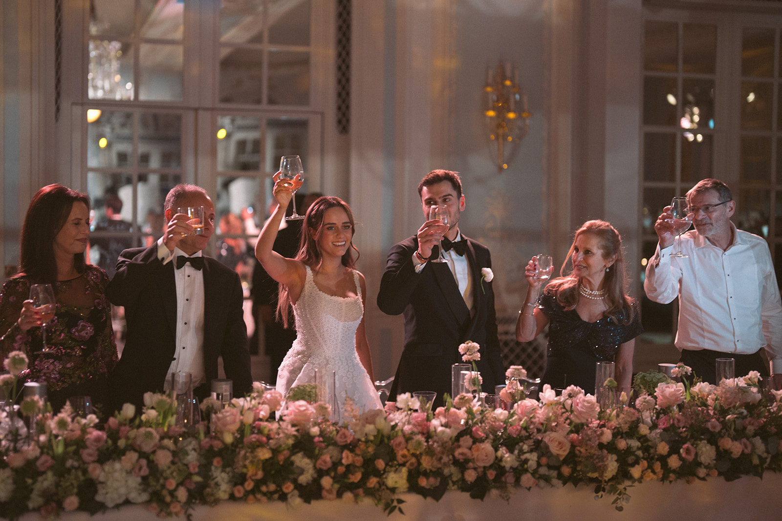 photograph of a luxury wedding at The Savoy in London with romantic floral styling and candlelight by Rachel Takes Pictures with Elegante by Michelle J