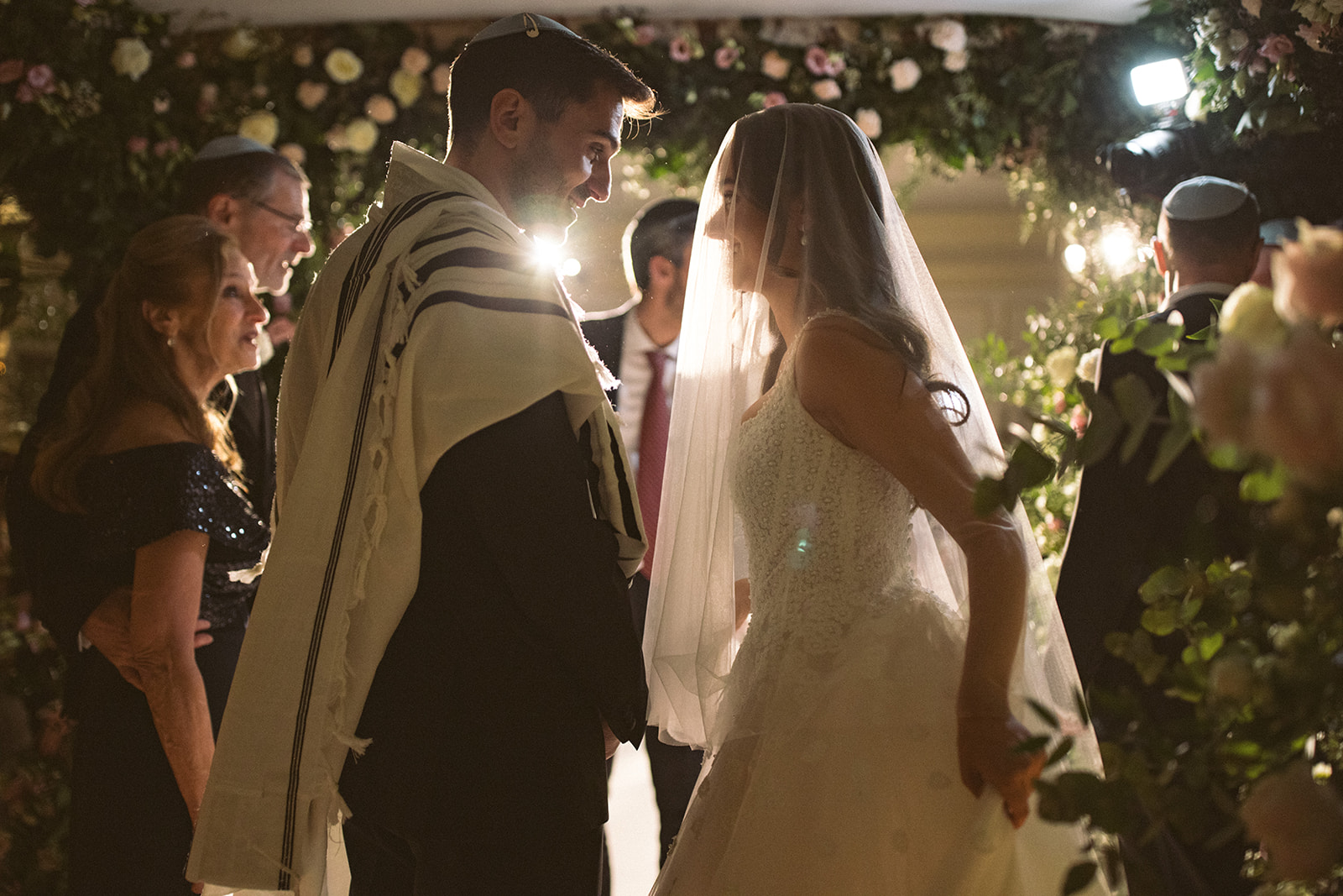 photograph of a luxury wedding at The Savoy in London with romantic floral styling and candlelight by Rachel Takes Pictures with Elegante by Michelle J