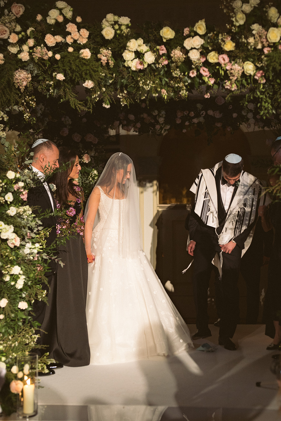 photograph of a luxury wedding at The Savoy in London with romantic floral styling and candlelight by Rachel Takes Pictures with Elegante by Michelle J