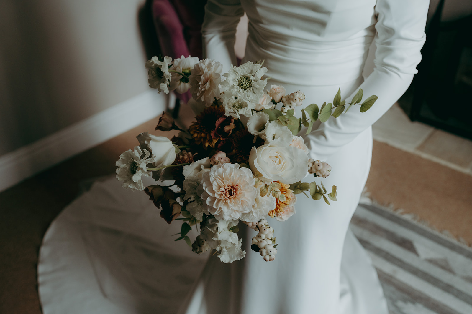 Real wedding at Thirsk Barn near Harrogate with a groom in a dark green suit and bride in a slim fitting dress with long gloves. Image by Yorkshire wedding photographer Joss Denham Photography