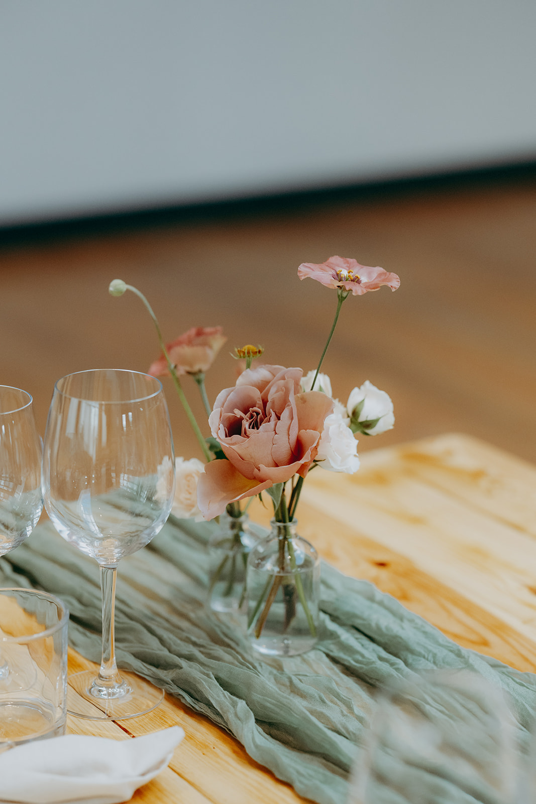 Real wedding at Thirsk Barn near Harrogate with a groom in a dark green suit and bride in a slim fitting dress with long gloves. Image by Yorkshire wedding photographer Joss Denham Photography