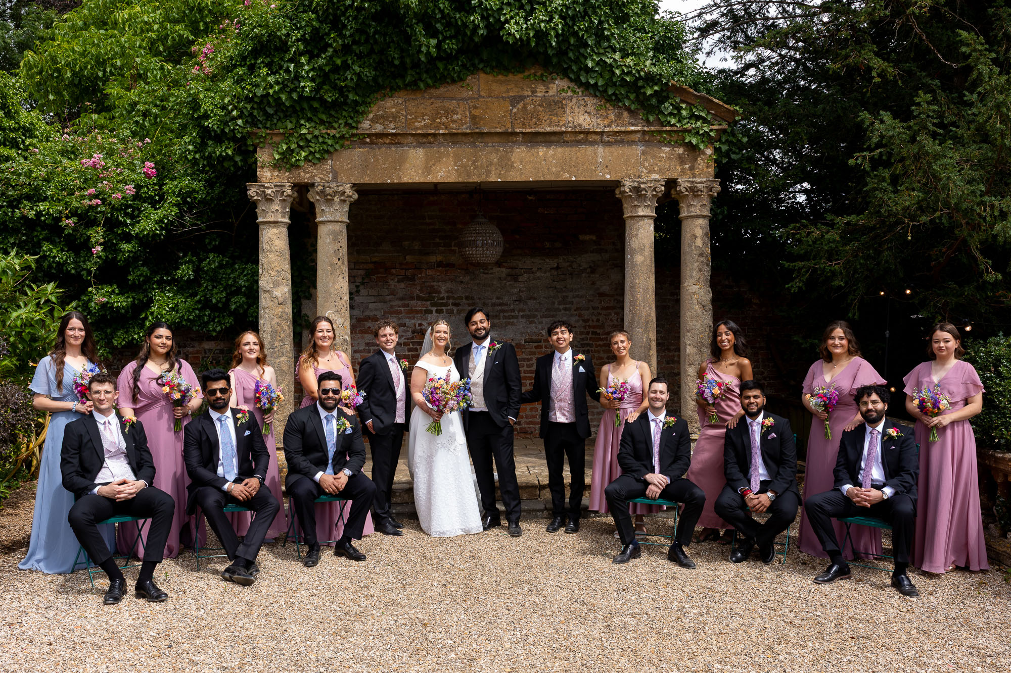 Photographs from an Indian wedding at Brympton House with really colourful flowers and a focus on human connection and love. By Martin Dabek Photography from Bristol