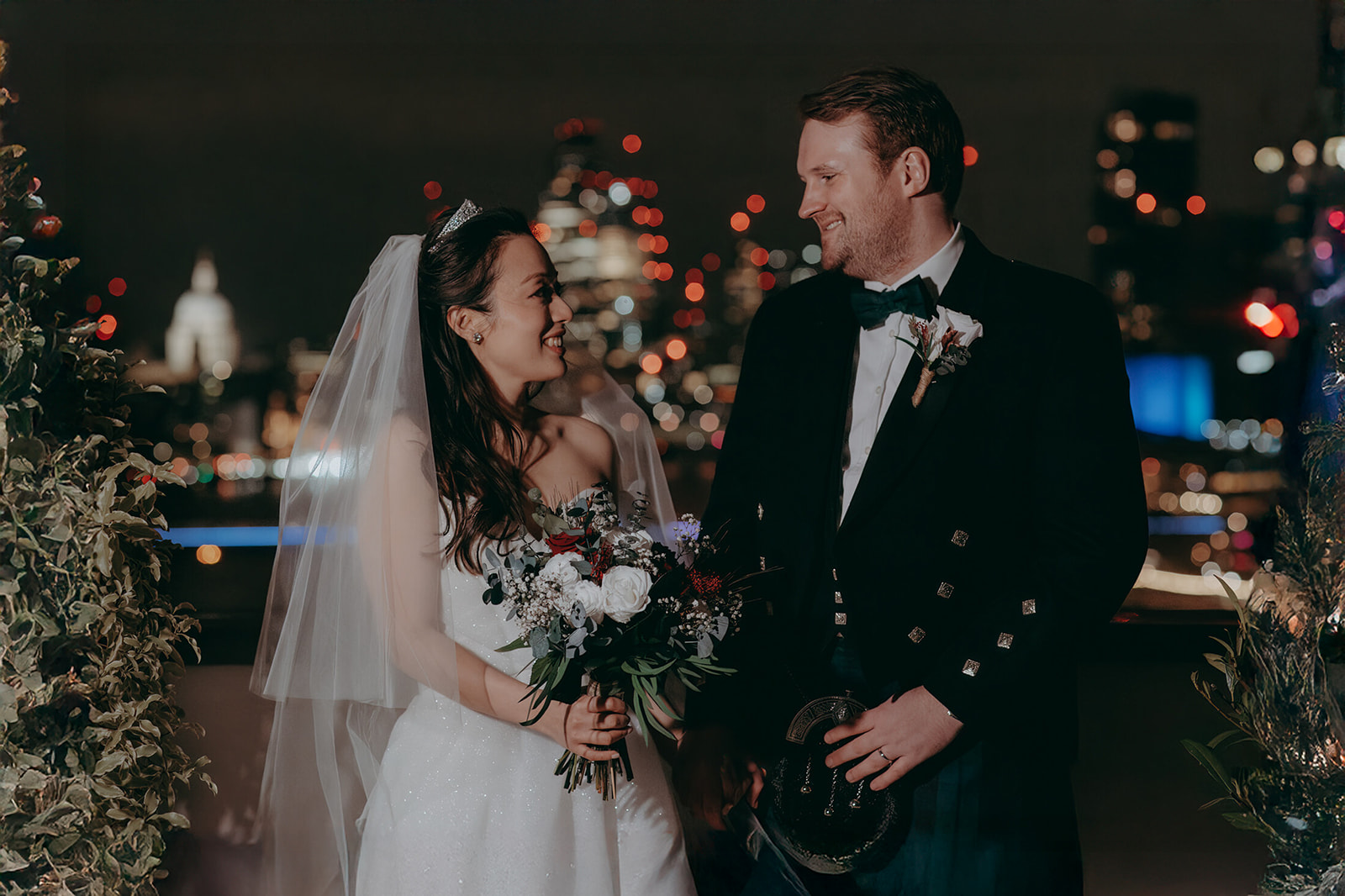 Romantic photo of a groom and bride looking at each other by Damien Vickers in Cambridge