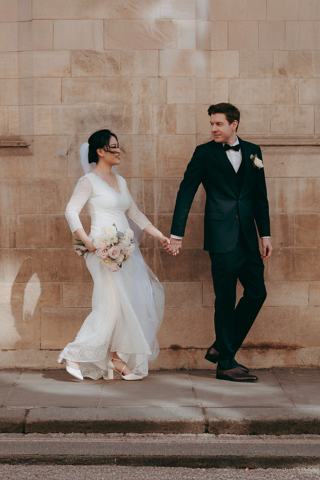 Classic Cambridge wedding elegance with a bride and groom in black tie by Damien Vickers Photography
