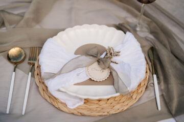 decorative place setting with ribbon and personalised tag showing wedding design and styling to create an atmosphere by Confetti Sweethearts