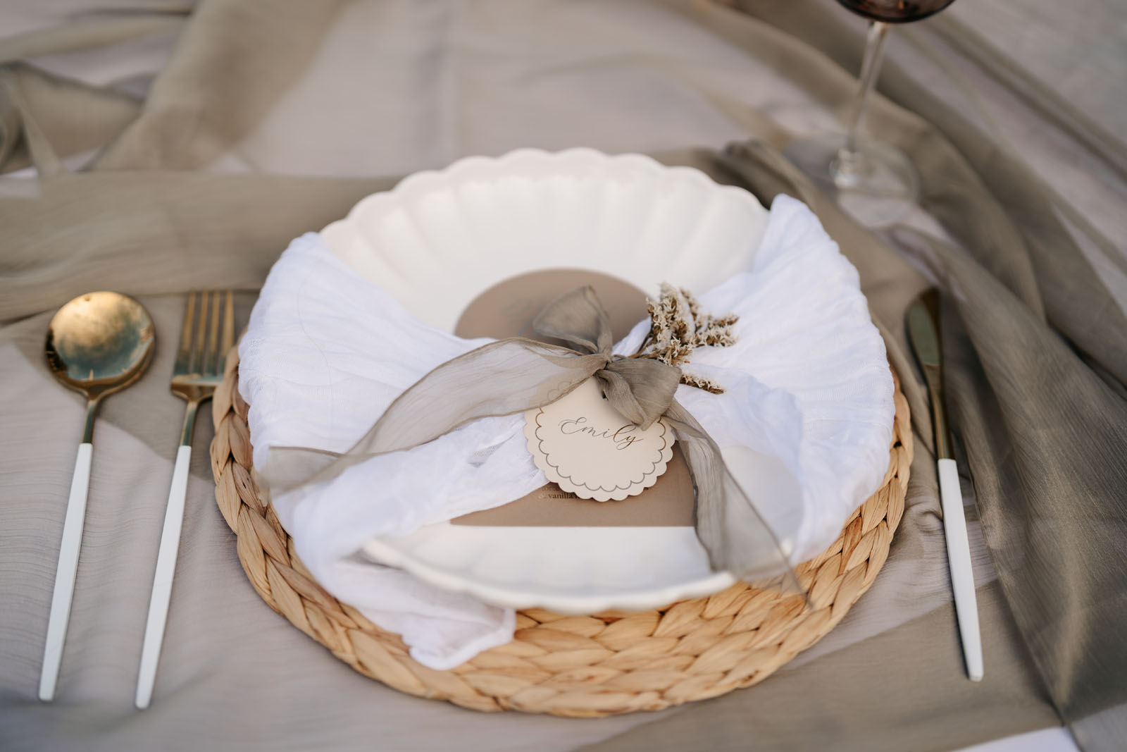 decorative place setting with ribbon and personalised tag showing wedding design and styling to create an atmosphere by Confetti Sweethearts