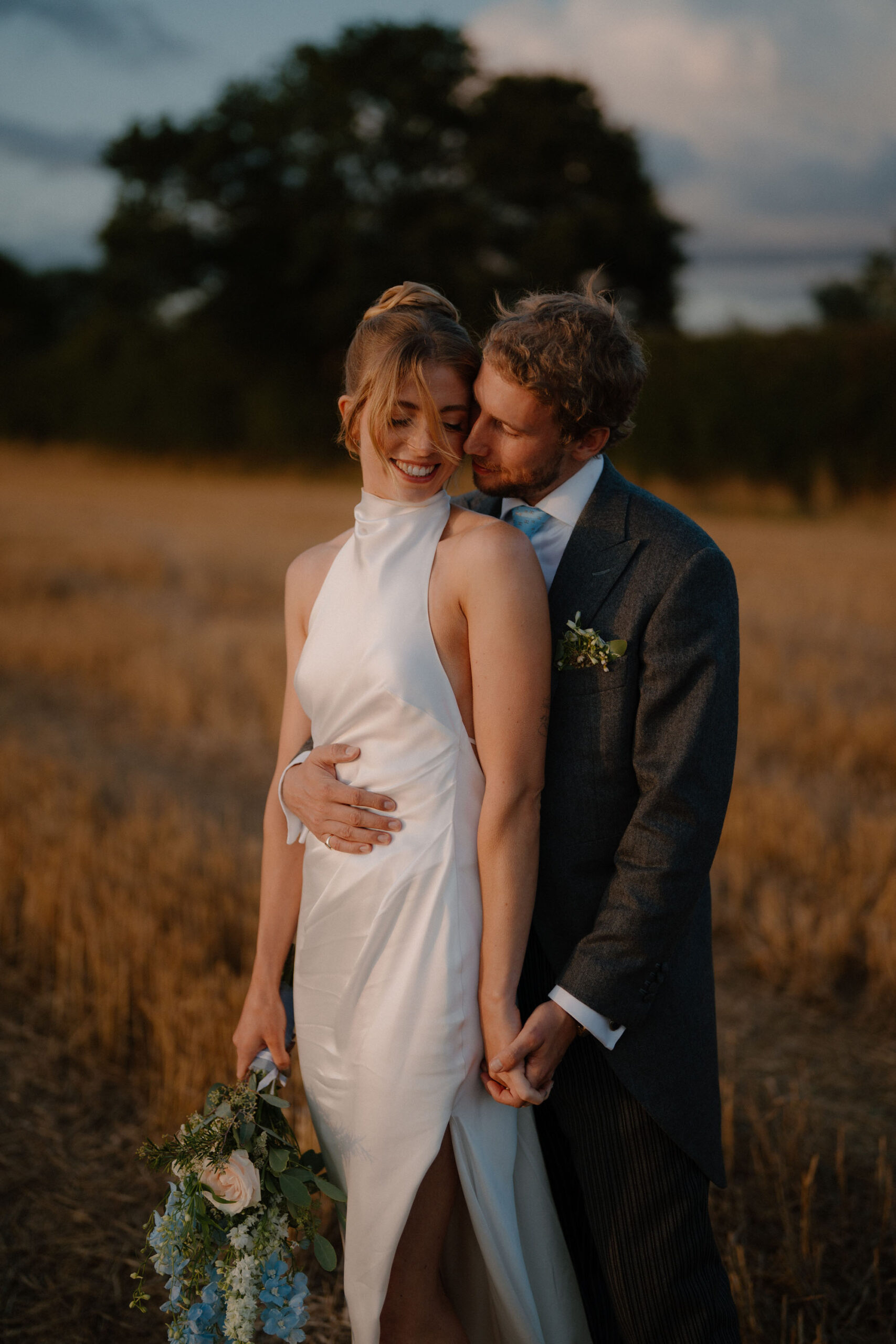 Romantic portrait of a groom and bride in the countryside by documentary photographer Tom Aizenberg