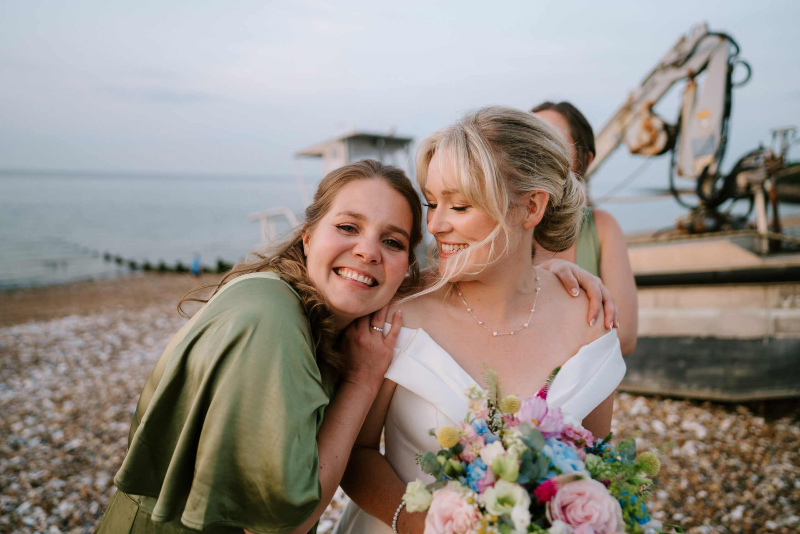 Super cute bridesmaid and bride image from East Quay wedding venue by Pearce Wedding Photography Kent