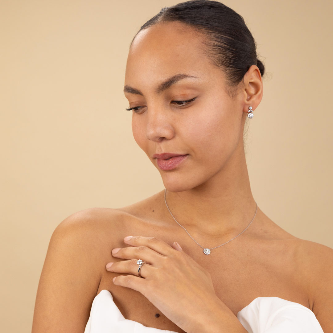 Model wearing necklace and engagement ring | Hatton Jewels in London