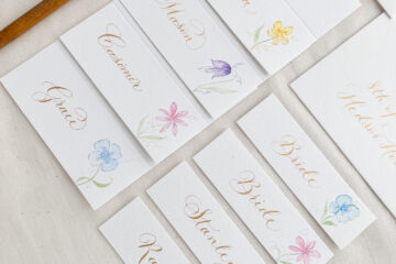 inclusive wedding calligraphy and stationery examples with two Bride place name cards | By Moon & Tide Calligraphy UK