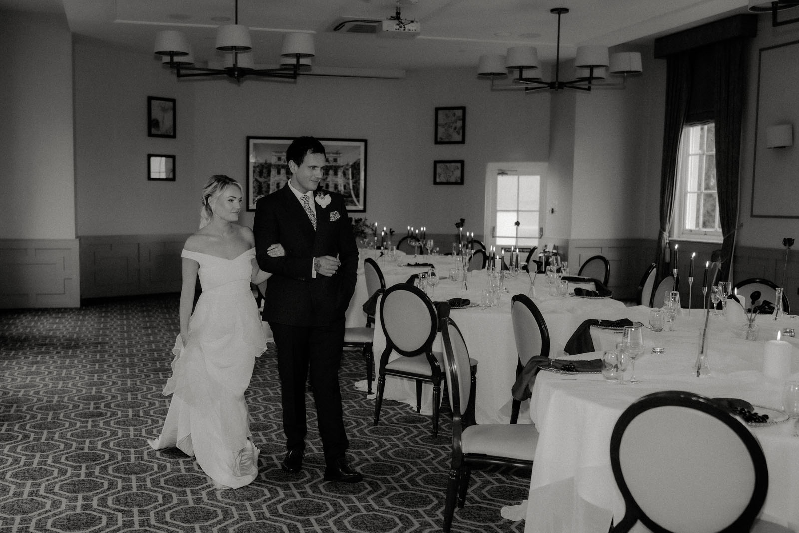 Models dressed as newlyweds entering a wedding venue styled by Lauren Batten Events