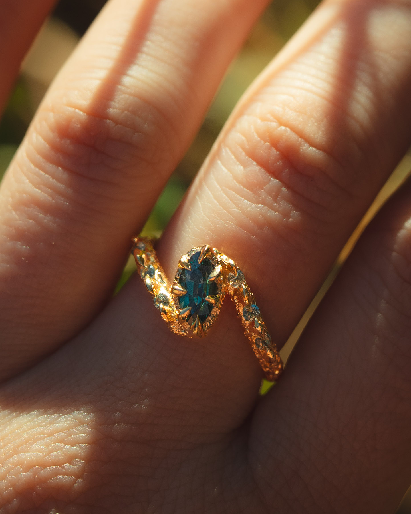 Unique gemstone engagement ring in organic green sapphire by Philippa Davin Fine Jewelry