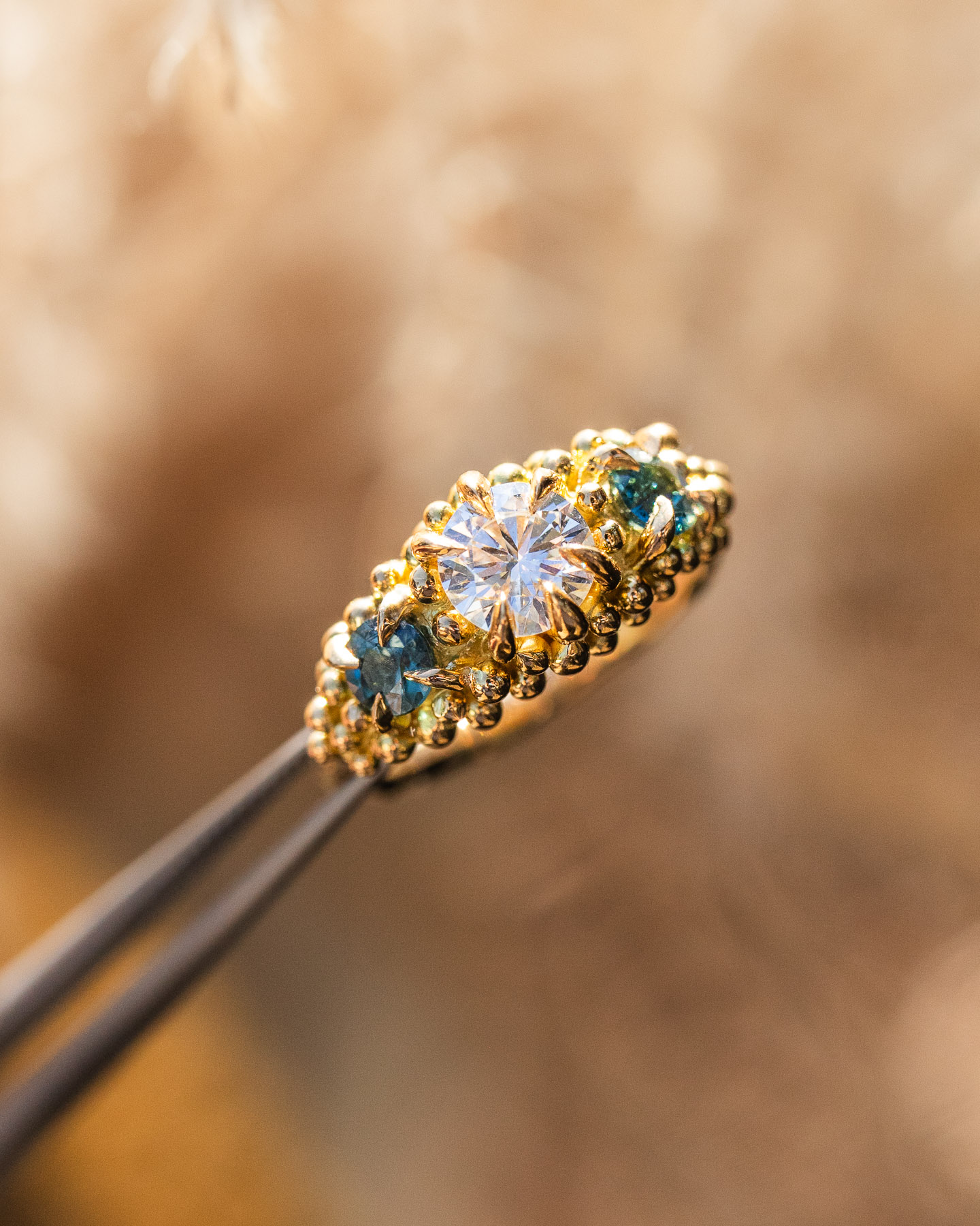 Three stone gold engagement ring ethically made by Philippa Davin
