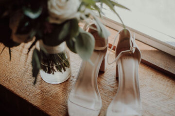 wedding bouquet and bridal shoes by Katelyn MacMillan on Unsplash