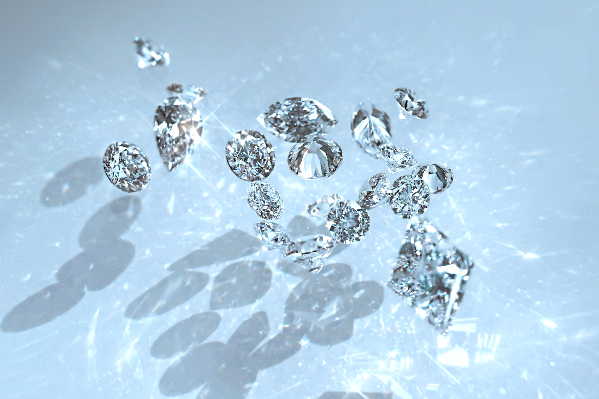 Natural certified diamonds in different cut sizes and shapes casting reflections and shadows | Lena Cohen Fine Jewellery London