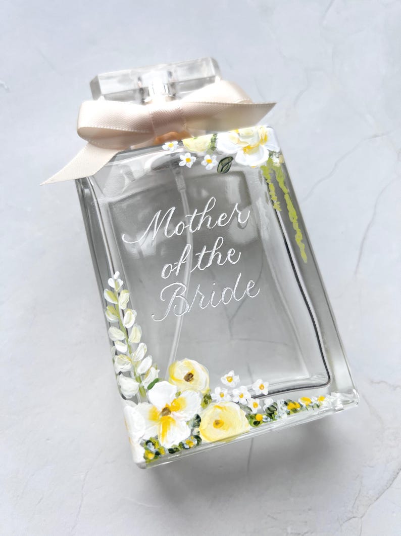 Delicately painted perfume bottle with white and yellow flowers and gold Mother of the Bride engraving